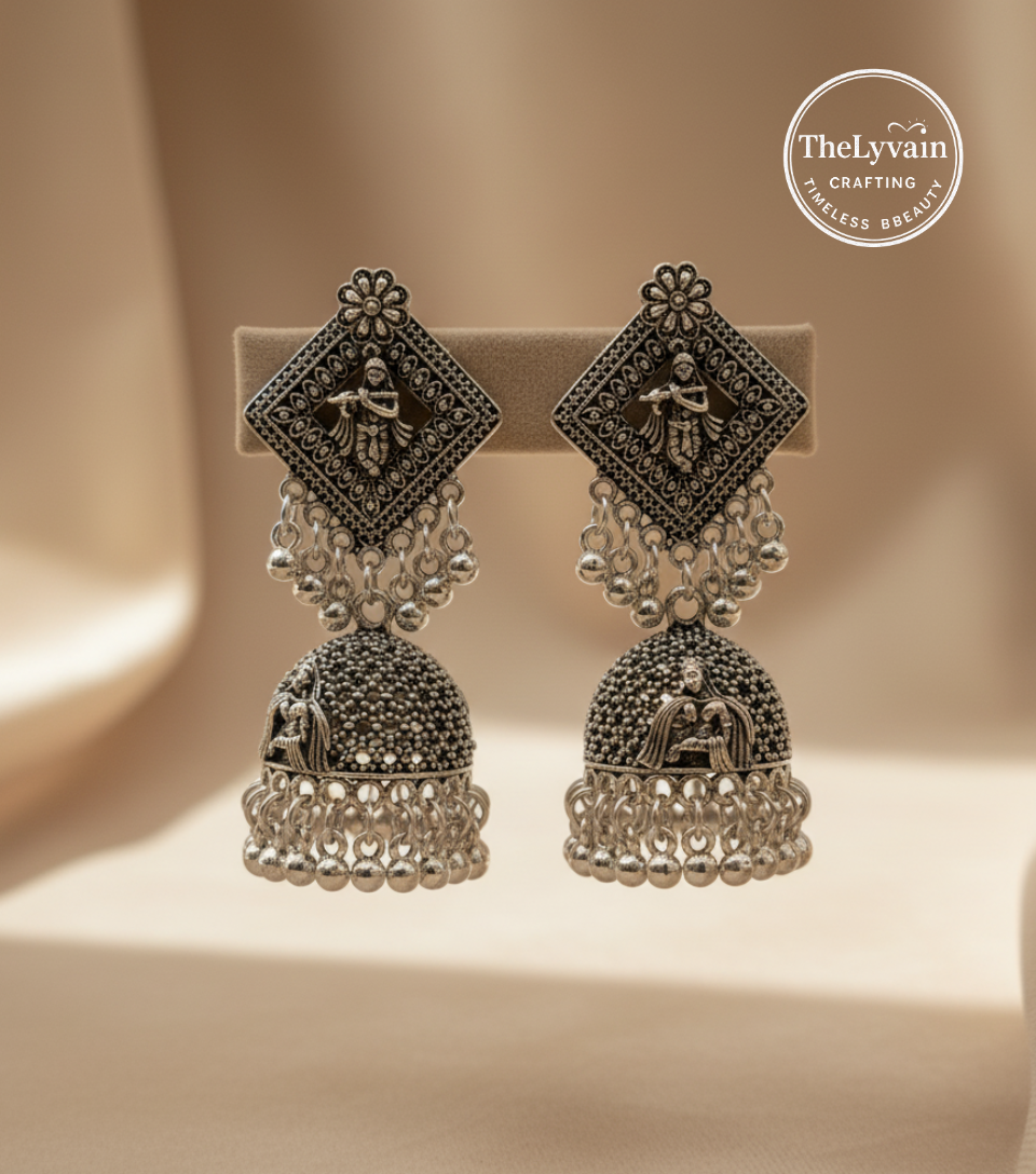 Handcrafted oxidized silver jhumka earrings with traditional motifs by TheLyvain