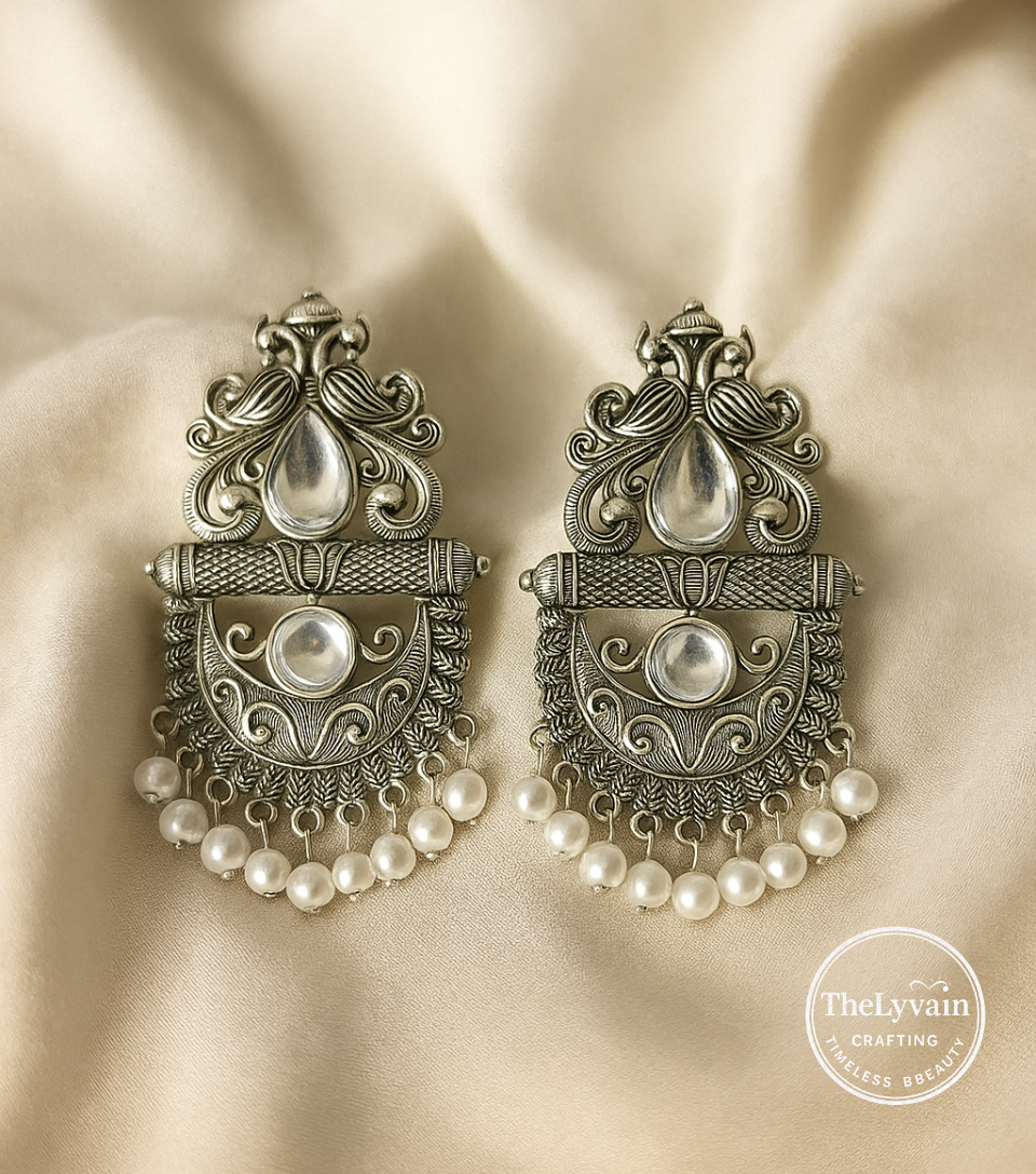 Antique oxidized silver earrings with pearl drop detailing and traditional engraved design by TheLyvain