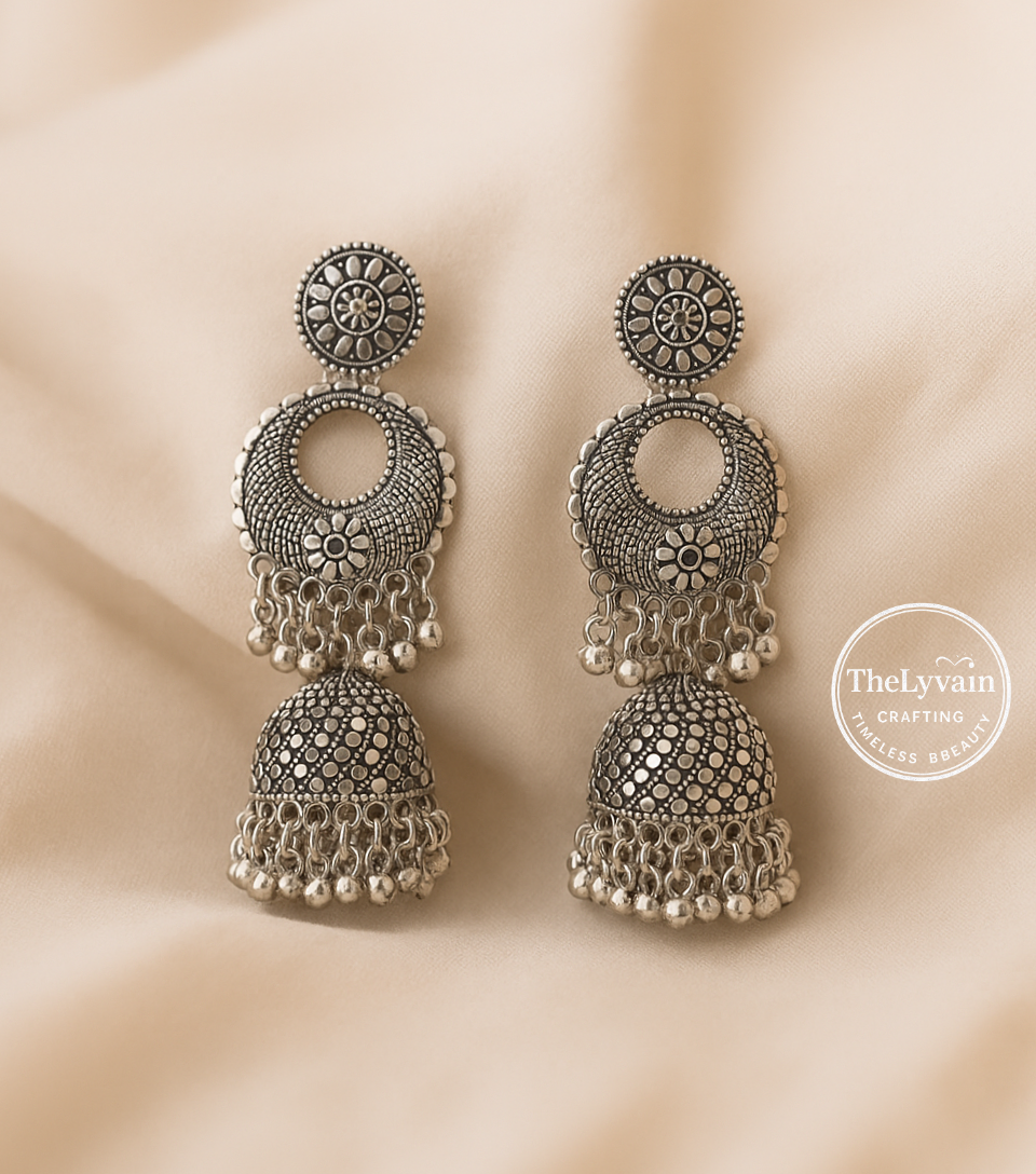 Oxidized silver jhumka earrings with floral crescent design and bead hangings by TheLyvain